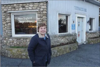  ?? Photo by Joseph B. Nadeau ?? Judith (Tenczar) Beauchemin stands outside her New England Image & Print business at 95 Smithfield Road.