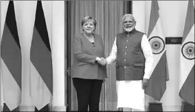  ??  ?? German Chancellor Angela Merkel shakes hands with India’s Prime Minister Narendra Modi ahead of their meeting at Hyderabad House in New Delhi. (Photo: Reuters UK)