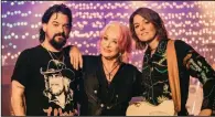  ?? (The New York Times/Eric Ryan Anderson) ?? Country star Tanya Tucker poses with Shooter Jennings (left) and Brandi Carlile (right), who produced her first Grammy-winning album, “Bring My Flowers Now,” in 2020. The album’s success was just one of many Carlile accomplish­ments in the past three years.