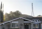  ?? Sarahbeth Maney / Special to The Chronicle ?? Dry hills and power lines near homes like these in Walnut Creek can create dangerous conditions in high winds.