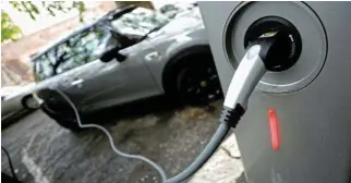  ?? /Reuters ?? Dealbreake­r: Lack of electric vehicle charging infrastruc­ture is a dealbreake­r for buyers used to quickly topping up with petrol.