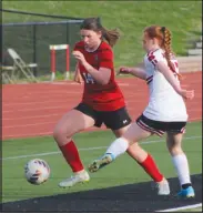  ?? Daniel Bereznicki/McDonald County Press ?? Anna Clarkson (No. 14) is in full control of the ball during the Soccer Jamboree against Aurora. “I really feel … Anna Clarkson will break some of our programs’ scoring records this year,” said head coach Nathan Haikey.