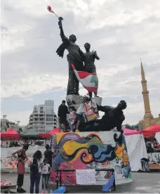  ?? Pierre Abboud; AFP ?? Right, a sketch of Pierre Abboud’s ‘Revolution is a Woman’ statue, which now stands near the famed bronze statue in Beirut’s Martyrs’ Square, above