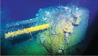  ??  ?? RELIC OF WAR – One of the USS Cooper’s five-inch guns is shown in this photo of the destroyer which was sunk by a Japanese torpedo on December 3, 1944. (Paul Allen)