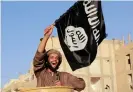  ??  ?? June 2014: An Isis fighter in Raqqa province celebrates after the group’s capture of territory in Iraq leads it to declare a worldwide Islamic ‘caliphate’ Photograph: Stringer/Reuters