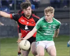  ??  ?? Jack Doran (Naomh Eanna) keeps the ball away from Jack Donohue.