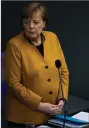  ?? (AP/Markus Schreiber) ?? German Chancellor Angela Merkel fields questions from lawmakers Wednesday at the Bundestag in Berlin.