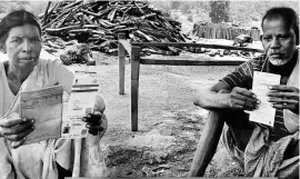  ??  ?? Lusiya Kullu ( left) and her husband’s Aadhaar numbers haven’t been seeded with their ration cards and so they haven’t received rations they are entitled to since March 2017