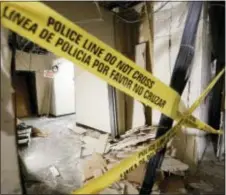  ?? ToNy GUTieRReZ — THe ASSoCiATeD PReSS FiLe ?? in this Tuesday file photo, damage from a blast is shown in a hallway at el Centro College downtown campus in Dallas. According to officials, this site is where gunman Micah Johnson was killed by the blast after he killed five police officers wounding...