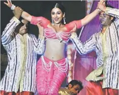  ?? — AFP photo ?? CENSORED: Bollywood actress Vidya Balan performs during the music launch event for the Hindi film “The Dirty Picture” in Mumbai. All Indian films have a common start. They begin by screening grainy footage of a certificat­e, handed down by the censor...