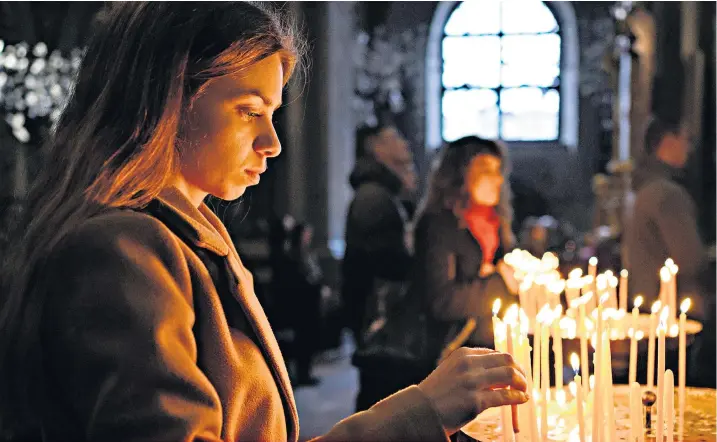  ?? ?? Worship may have been a source of solace during the war, but Russia’s far-reaching grip is even felt within the walls of the church