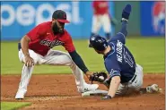  ?? TONY DEJAK — THE ASSOCIATED PRESS ?? Indians’ Amed Rosario tags out Rays’ Austin Meadows at second base on a steal attempt during the sixth inning, July 22 in Cleveland.