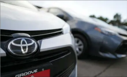  ?? THE ASSOCIATED PRESS ?? This file photo shows the Toyota company logo on a car at a Toyota dealership in Englewood, Colo. Foreign automakers, American manufactur­ers and classic-car enthusiast­s are coming out against President Donald Trump’s plan to consider taxing imported...