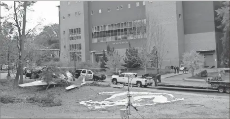  ?? / Special to the MDJ-Courtesy Avery Guthrie ?? Officials survey the scene Friday after a plane crashed on the Kennesaw campus of Kennesaw State University on Thursday.