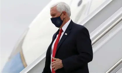  ??  ?? Mike Pence wears a face mask as he arrives in Dallas on Sunday. Photograph: Tony Gutierrez/AP