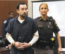  ?? Dale G. Young / Associated Press ?? Longtime national gymnastics team doctor Larry Nassar is being sentenced on multiple counts of sexual assault.