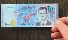  ?? Sami Moubayed/Gulf News ?? Activists are opposed to the issuing of the new 2,000 Syrian pound banknote issued by the Central Bank of Syria.