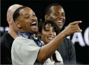  ?? DITA ALANGKARA — THE ASSOCIATED PRESS ?? U.S. actor Will Smith reacts after watching the third round match between France’s JoWilfried Tsonga and Australia’s Nick Kyrgios at the Australian Open tennis championsh­ips in Melbourne, Australia, Friday.