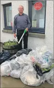  ?? ?? Southend Community Council convener John Bakes with the 19 bags of litter collected in the village.