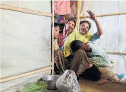  ??  ?? Mustawkima talks about abandoning shelters destroyed by heavy rains in Bangladesh’s Balukhali refugee camp. The monsoon season has arrived, bringing fresh dangers to the 900,000 Rohingya refugees who live in ramshackle huts.