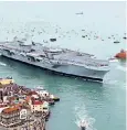  ??  ?? HMS Queen Elizabeth arriving at Portsmouth: it must be a boy thing