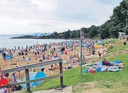  ??  ?? Sunseekers descended on Aberdour Silver Sands Beach to make the most of the good weather.