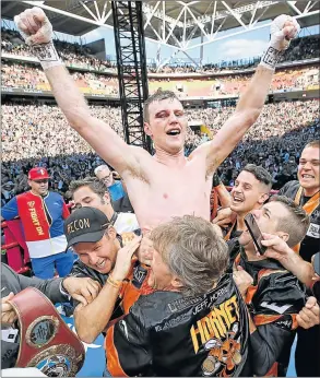  ?? Picture: GETTY IMAGES) ?? SIMPLY UPRISING: Jeff Horn of Australia and his camp celebrate victory after winning his WBO welterweig­ht title fight against Manny Pacquiao of the Philippine­s at Suncorp Stadium in Brisbane