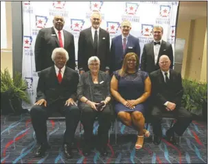  ?? Arkansas Democrat-Gazette/Thomas Metthe ?? CLASS OF 2018: The 2018 inductees and representa­tives, in front, into the Arkansas Sports Hall of Fame honored on Friday in Little Rock from left were Oliver Elders; Bettye Wallace; Jerval Watson, daughter of Jerry Eckwood; and Dean Weber, and back,...