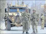  ?? AP ?? British soldiers with NATO-led Resolute Support Mission forces
■ arrive near the site of an attack in Kabul on Friday.