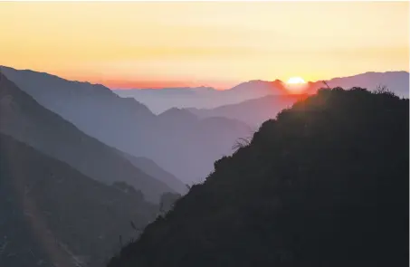  ?? Dania Maxwell / Special to The Chronicle ?? The sun sets in the San Gabriel Mountains, where 346,177 acres of federal land were designated as a national monument in 2014.