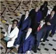  ?? REUTERS ?? US HOUSE of Representa­tives Clerk Cheryl Johnson and House Sergeant at Arms Paul Irving carry two articles of impeachmen­t against US President Donald Trump during a procession with the seven US House impeachmen­t managers through Statuary Hall in the US Capitol in Washington, Jan. 15.