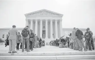  ?? Eric Thayer / New York Times ?? Lines form outside the Supreme Court on Tuesday as justices hear a case about voting rights in Texas.