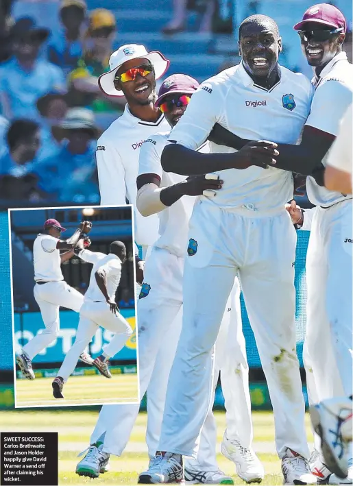 ??  ?? SWEET SUCCESS: Carlos Brathwaite and Jason Holder happily give David Warner a send off after claiming his wicket.