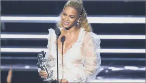  ??  ?? WINNING WAYS: Beyonce accepts the award for Video of the Year at the MTV Video Music Awards.