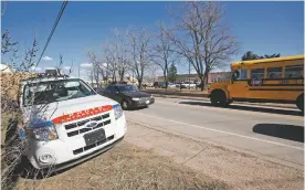  ?? LUIS SÁNCHEZ SATURNO/NEW MEXICAN FILE PHOTO ?? A school bus drives past a parked speed SUV in a school zone on March 4, 2010. The Santa Fe City Council is expected to vote Wednesday on whether to bring back the speed-enforcemen­t program.