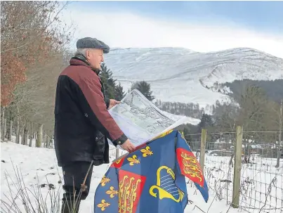  ?? Picture: Angus Findlay. ?? Campaigner James Rattray at Killiecran­kie with a copy of the plan for the new road which, he claims, will adversely affect the historic battlefiel­d.