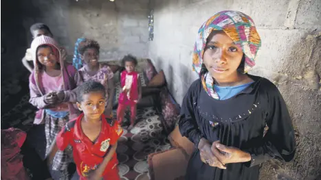  ??  ?? Children displaced from the Red Sea port city of Hodeidah stand in their shelter in Sana’a, Yemen, Nov. 1.