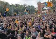  ?? [AP PHOTO] ?? Pro-independen­ce supporters take part in a rally Tuesday in Barcelona, Spain. Catalan President Carles Puigdemont said during his speech in the parliament that the region remained committed to independen­ce but said it should follow dialogue with the...