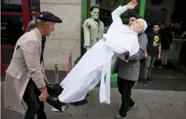  ?? — AP ?? A newly unveiled wax work of Pope Francis is carried at the National Wax Museum Plus where they also unveiled a newly refurbishe­d original 1979 Pope Mobile ahead of Pope Francis' visit to Ireland in Dublin on Thursday.