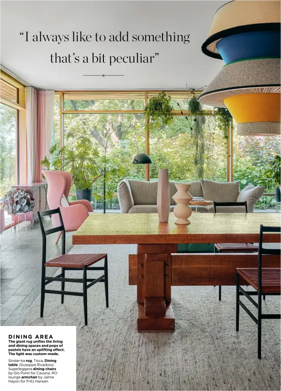  ?? ?? The giant rug unifies the living and dining spaces and pops of pastels have an uplifting effect. The light was custom-made.
Sindar-ka rug, Tisca. Dining table, Giuseppe Rivadossi.
Superlegge­ra dining chairs by Gio Ponti for Cassina. RO l8ou8ngeli­avrimngche­atcir.cboymjaime Hayon for Fritz Hansen DINING AREA