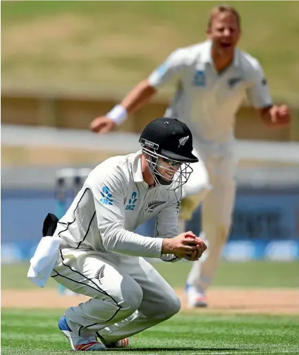  ?? PHOTO: PHOTOSPORT ?? Henry Nicholls takes a close-in catch to dismiss West Indies batsman Shane Dowrich, much to the delight of Black Caps bowler Neil Wagner.