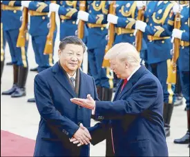  ??  ?? US President Donald Trump takes part in a welcoming ceremony with China’s President Xi Jinping in Beijing yesterday.