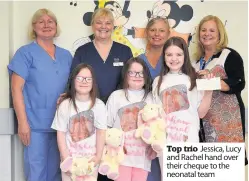  ??  ?? Top trio Jessica, Lucy and Rachel hand over their cheque to the neonatal team