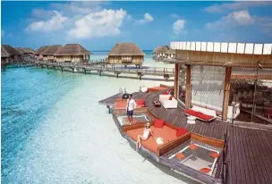  ??  ?? Relax in a private villa, suite or overwater bungalow set among the tranquilli­ty in Club Med Kani.