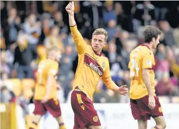  ??  ?? Cheers Elliott Frear celebrates his late winner for Motherwell against Berwick (Pic by Rob Casey/sns Pics)