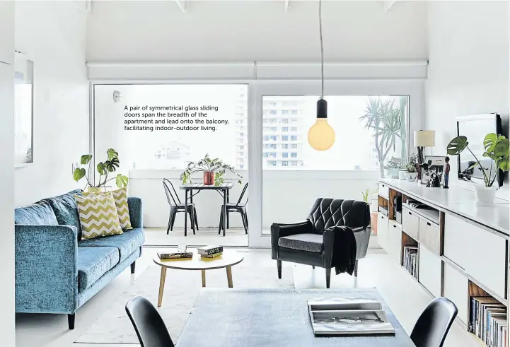  ?? Text Laura Twiggs/ bureaux.co.za Styling Sven Alberding/ bureaux.co.za Photograph­s Warren Heath/ bureaux.co.za ?? A pair of symmetrica­l glass sliding doors span the breadth of the apartment and lead onto the balcony, facilitati­ng indoor-outdoor living.