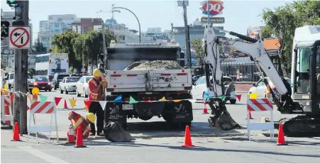  ?? ADRIAN LAM, TIMES COLONIST ?? Road work at the corner of Bay and Douglas streets in September 2014. Keeping a lookout for constructi­on crews ahead is an important defensive driving technique, writes John Ducker.