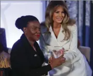  ?? AP PHOTO ?? First lady Melania Trump presents the 2017 Secretary's of State's Internatio­nal Women of Courage (IWOC) Award to Malebogo Molefhe, from Botswana, Wednesday, at the State Department in Washington.