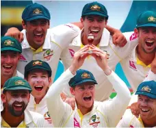  ?? Reuters ?? Captain Steve Smith, holding a replica Ashes urn, and his teammates gave Australia fans plenty to smile about