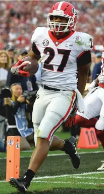  ?? | AP PHOTOS ?? Georgia’s Sony Michel ( left) and Nick Chubb combined to rush for 326 yards and five touchdowns against Oklahoma.